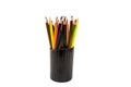 Color pencils on a black stand isolated on a white background. Royalty Free Stock Photo