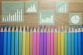 Color pencils with business graphs and charts, Stock market investment trading, Statistic and data, Financial and economy Royalty Free Stock Photo