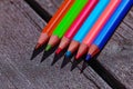 Color pencils close-up on a wooden table. Pencils to school. Bright design solutions