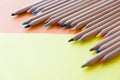 Color pencils, on colored paper. Top view, flat lay. Close up on a white background. copy space for text Royalty Free Stock Photo