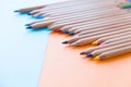 Color pencils, on colored paper. Top view, flat lay. Close up on a white background. copy space for text Royalty Free Stock Photo