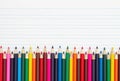 Color pencils crayons on vintage ruled line notebook paper Royalty Free Stock Photo