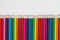 Color pencils crayons on vintage ruled line notebook paper Royalty Free Stock Photo