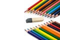 Color pencils and eraser on a white background. Place for text. Royalty Free Stock Photo