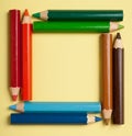 Color pencils forming a square frame Royalty Free Stock Photo