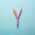 Color pencils forming a Y shaped fork. Back to school, choice and guidance background.