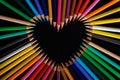 Color pencils heart isolated on black background close up with Clipping path.Beautiful color pencils.Color pencils for drawing Rai Royalty Free Stock Photo