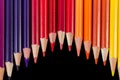 Color pencils in wave formation isolated on black background close-up Royalty Free Stock Photo