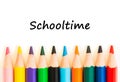 Color pencils isolated on white background. Text schooltime.