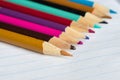 The color pencils lying on an open writing-book Royalty Free Stock Photo