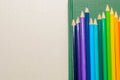 Color pencils, notebook on white background Royalty Free Stock Photo