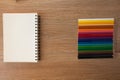 Color pencils with notebook Royalty Free Stock Photo