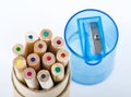 Color pencils and pencil sharpener Royalty Free Stock Photo