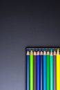 Color Pencils with plastic case isolated on Black Background clo Royalty Free Stock Photo