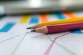 Color pencils on printed charts, close-up view Royalty Free Stock Photo