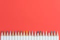 Color pencils on red background with copy space using as coloring or art concept Royalty Free Stock Photo