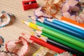 Color pencils, sharpener and shavings on table, closeup Royalty Free Stock Photo