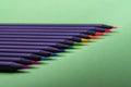 Color pencils of various color on a green background Royalty Free Stock Photo