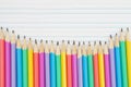 Color pencils on vintage ruled line notebook paper Royalty Free Stock Photo