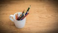 Color pencils in white coffee cup Royalty Free Stock Photo