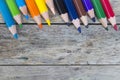 Color pencils on wood plank Royalty Free Stock Photo