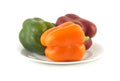 Color peppers on plate isolated close up Royalty Free Stock Photo