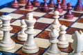 Color photo of chess Board and chess pieces, wooden chess pieces on the chessboard. White Queen and King in the foreground is a So Royalty Free Stock Photo