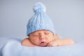 Newborn Baby Boy Sleeping Peacefully in Knit Hat Royalty Free Stock Photo