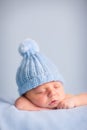 Newborn Baby Boy Sleeping Peacefully in Knit Hat Royalty Free Stock Photo
