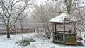 First snow and Frozen little garden house and frozen garden