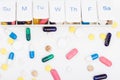 Color pills capsules and weekly pill organizer Royalty Free Stock Photo