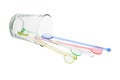 Color plastic swizzle sticks spilled from glass Royalty Free Stock Photo