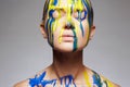 Color portrait of Girl in Paint over face and Body
