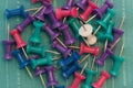 Color Pushpins On Teal Royalty Free Stock Photo