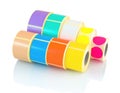 Color reels of labels. Colored label rolls isolated on white background with shadow reflection. Labels for printers.