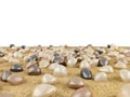 Color river pebbles on sand surface