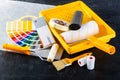 Color samples catalog, brush, paint tray and paint rollers, diff