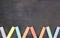 Color school chalk on a black board Royalty Free Stock Photo