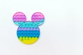 Color sensory pop it antistress toy for children. rainbow toy on white background.Pop it trendy toy.Copy space