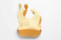 Color silicone baby bibs isolated on white, top view Royalty Free Stock Photo