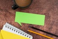 Color Speech Bubble With Spiral Notebook, Pencils And Coffee Mug Placed On Wooden Table. It Is Showing New Ideas And Royalty Free Stock Photo