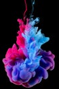 Color splash of ink in water on black background Royalty Free Stock Photo