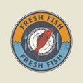 Color stamp with fish shape and the word Fresh fish