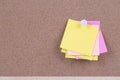 Color sticky note on cork board with blank notes, empty space for text Royalty Free Stock Photo