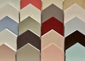 Color swatch paint sample cards on display in a hardware store with neutral earth tones. Royalty Free Stock Photo