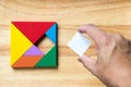 Color tangram puzzle in square shape that wait for fulfill