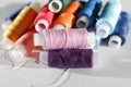 Color thread. Plastic reels with multicolored threads on a white background Royalty Free Stock Photo