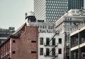 Color toned picture of Manhattan cityscape with water tower and fire escape, New York City, USA Royalty Free Stock Photo