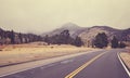 Color toned road on a cloudy day, Colorado, USA. Royalty Free Stock Photo