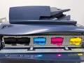 Color toners in the digital laser printer. (cyan, magenta, yellow, black) Royalty Free Stock Photo